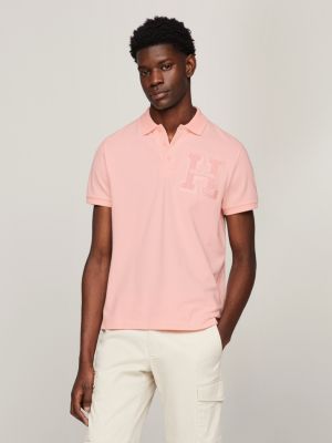 pink regular fit poloshirt mit bouclé-logo für herren - tommy hilfiger