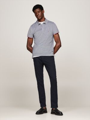 polo de corte slim con detalles ribeteados azul de hombres tommy hilfiger