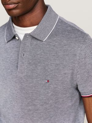 polo de corte slim con detalles ribeteados azul de hombres tommy hilfiger