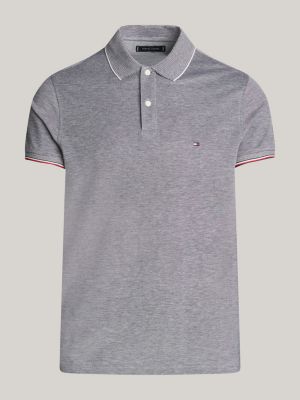 polo de corte slim con detalles ribeteados azul de hombres tommy hilfiger