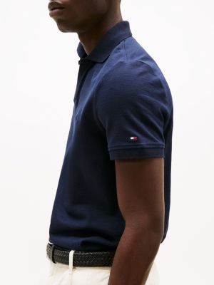 polo coupe standard en tissu éponge bleu pour hommes tommy hilfiger