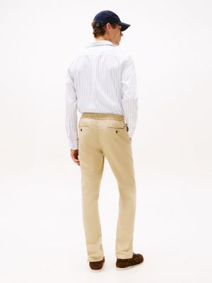 beige harlem relaxed tapered leg chinos for men tommy hilfiger