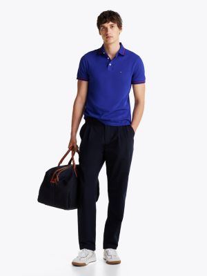 polo ribeteado de corte slim azul de hombres tommy hilfiger