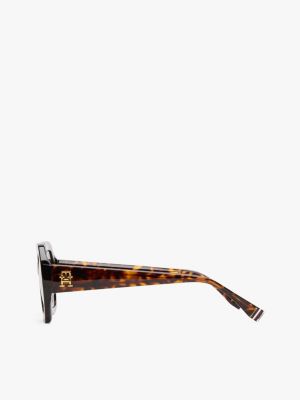 lunettes de soleil hexagonales à monogramme jaune pour femmes tommy hilfiger