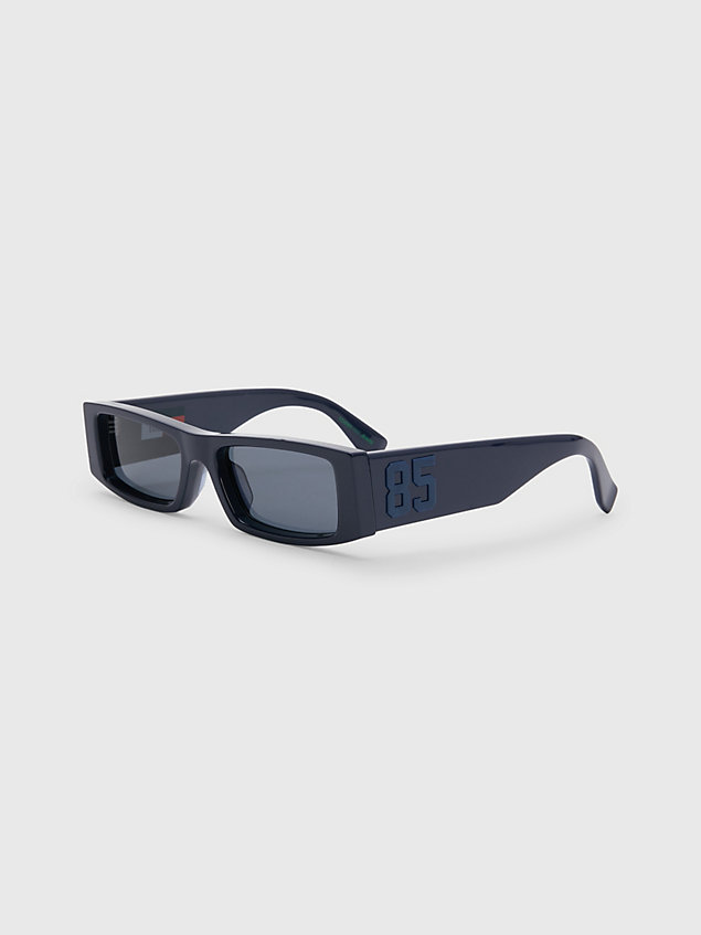 blue sonnenbrille mit transparentem rahmen für unisex - tommy jeans