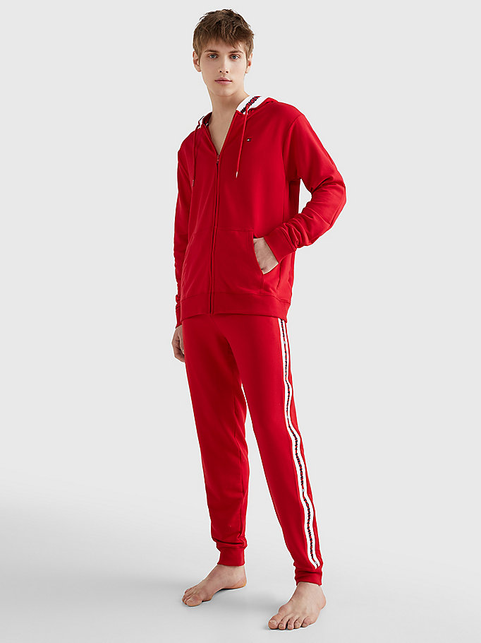 rot jogginghose mit tunnelzug und logo-tape für herren - tommy hilfiger