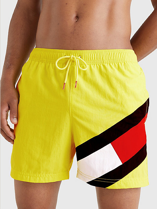 yellow flag mid length drawstring swim shorts for men tommy hilfiger