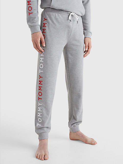 grau jogginghose mit logo-stickereien für herren - tommy jeans