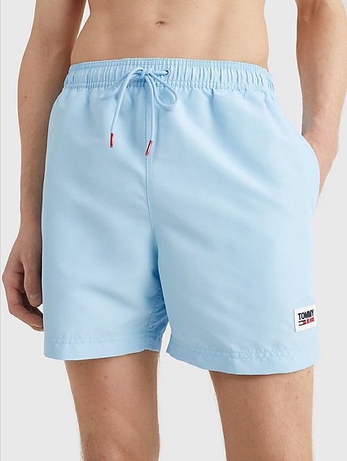 blue logo patch mid length swim shorts for men tommy jeans