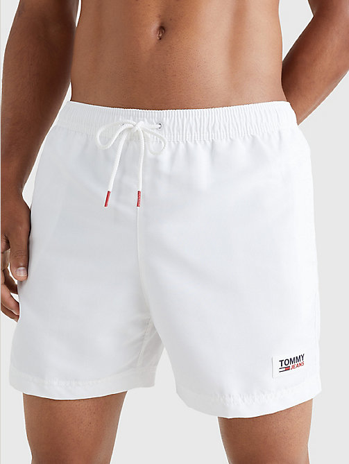 white logo patch mid length swim shorts for men tommy jeans