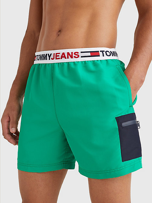 green logo waistband mid length swim shorts for men tommy jeans