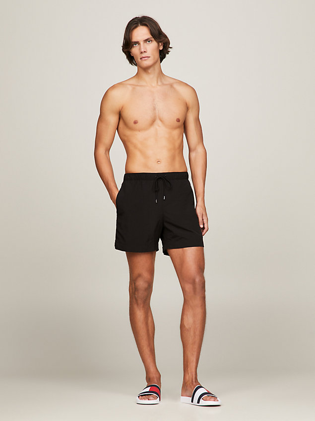 black essential mid length swim shorts for men tommy hilfiger