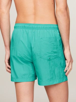 green heritage mid length crinkle swim shorts for men tommy jeans