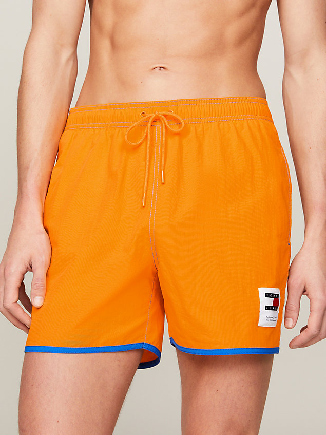 yellow contrast mid length slim swim shorts for men tommy jeans