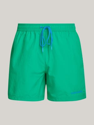 green logo mid length slim swim shorts for men tommy jeans