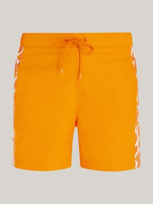 orange th monogram reveal mid length swim shorts for men tommy hilfiger