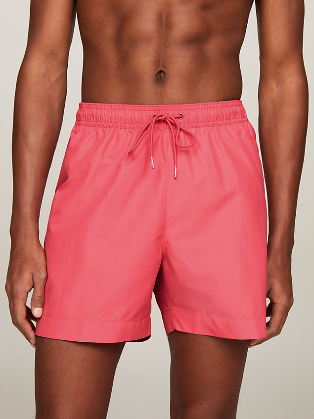pink original logo mid length swim shorts for men tommy hilfiger