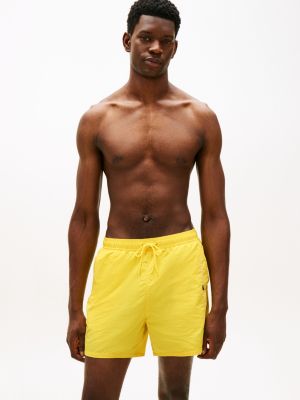 yellow original logo mid length swim shorts for men tommy hilfiger