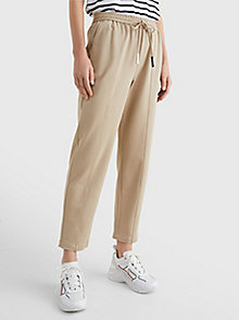 beige tape drawstring tapered fit trousers for women tommy hilfiger