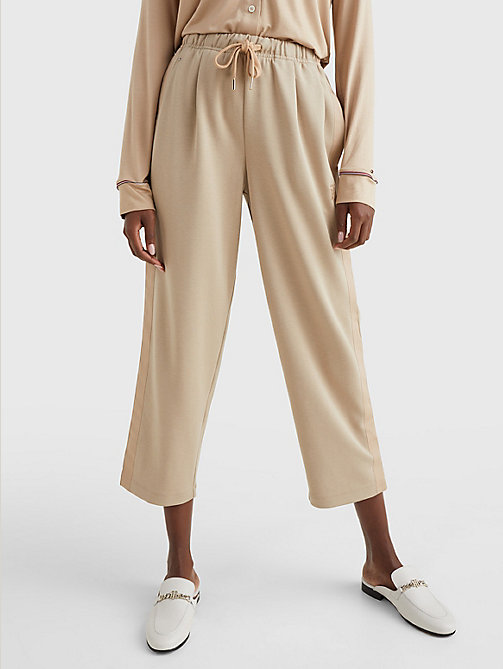beige relaxed fit drawstring trousers for women tommy hilfiger