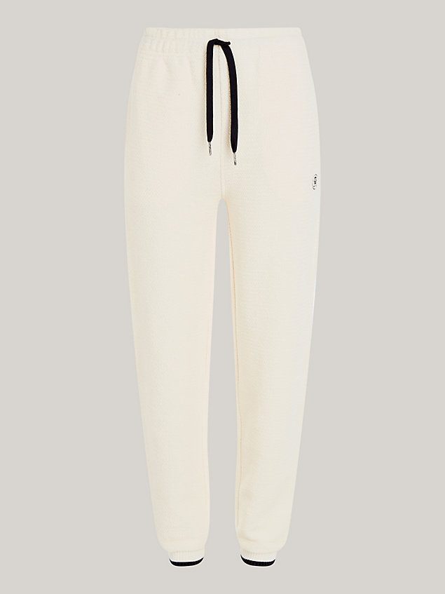 beige th monogram textured tapered joggers for women tommy hilfiger