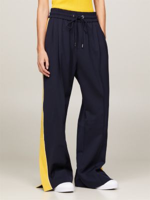 Tommy Hilfiger CREST - Tracksuit bottoms - desert sky/dark blue 