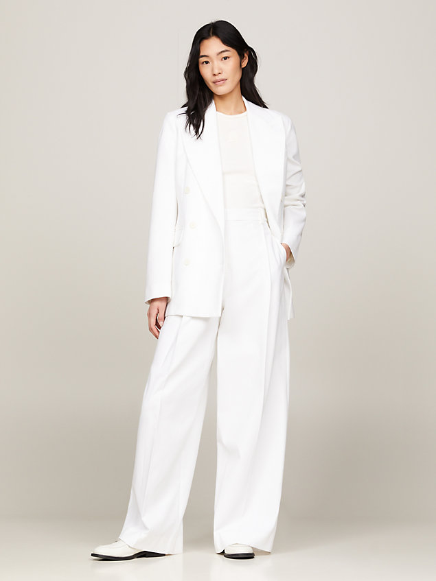 white spodnie z rozszerzanymi nogawkami i emblematem dla kobiety - tommy hilfiger