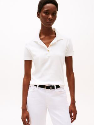 weiß poloshirt mit goldknopf und slim fit für damen - tommy hilfiger